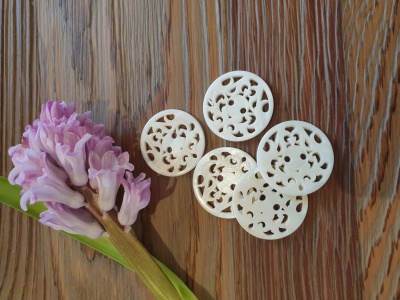Large pearl buttons with laser engraved lace design